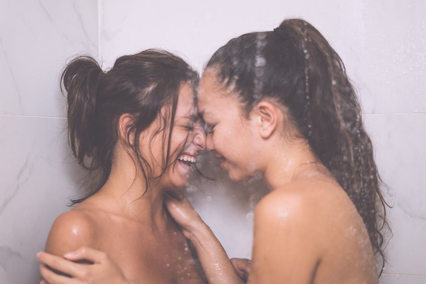 Two women in the shower together